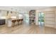 Gourmet kitchen with a marble island, pendant lights, stainless steel appliances, and breakfast bar seating at 4777 Duhme Rd # 1A, St Petersburg, FL 33708