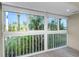 Bright living room with large windows providing views of the surrounding landscape at 4777 Duhme Rd # 1A, St Petersburg, FL 33708