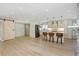 Stylish kitchen and living area, featuring stainless steel appliances, a barn door, and open layout at 4777 Duhme Rd # 1A, St Petersburg, FL 33708