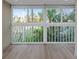 Living room with large windows overlooking the garden view at 4777 Duhme Rd # 1A, St Petersburg, FL 33708