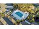 Aerial view of a community pool surrounded by ample seating and tropical landscaping at 4777 Duhme Rd # 1A, St Petersburg, FL 33708
