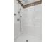 Modern shower with a multi-head shower fixture and integrated shelving at 4777 Duhme Rd # 1A, St Petersburg, FL 33708