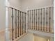 Staircase featuring modern metal railing accents and wood flooring at 4777 Duhme Rd # 1A, St Petersburg, FL 33708