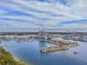 Stunning aerial view showcasing waterfront property with a marina, modern architecture, and beautiful landscaping at 5120 Marina Way # 6603, Tampa, FL 33611