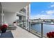 Gorgeous view from condo balcony with tile flooring and luxurious seating area with potted plants at 5120 Marina Way # 6603, Tampa, FL 33611