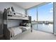 Bunk room with a twin over full bunk, and a large window with water views at 5120 Marina Way # 6603, Tampa, FL 33611