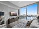 Bedroom showcases waterfront views, complemented by a dresser and a decorative mirror at 5120 Marina Way # 6603, Tampa, FL 33611