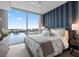 Bedroom with a patterned wallpaper and a large window overlooking water and a cityscape at 5120 Marina Way # 6603, Tampa, FL 33611