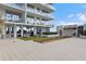 A well-maintained bocce court with inviting seating and a modern building in the background at 5120 Marina Way # 6603, Tampa, FL 33611