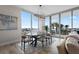 Bright dining area with a modern chandelier and floor-to-ceiling windows offering expansive views at 5120 Marina Way # 6603, Tampa, FL 33611