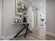 Inviting entryway with stylish console table, decorative art, and wood-look flooring at 5120 Marina Way # 6603, Tampa, FL 33611