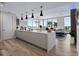 Bright, open kitchen with a spacious island, stylish pendant lights, and water views at 5120 Marina Way # 6603, Tampa, FL 33611