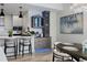 Bright modern kitchen with island bar, custom cabinets, and lighting in open concept home at 5120 Marina Way # 6603, Tampa, FL 33611