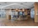Modern kitchen featuring a spacious island, bar stool seating, and designer lighting at 5120 Marina Way # 6603, Tampa, FL 33611