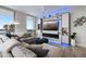 Elegant living room featuring a large window with a beautiful view, contemporary decor, and custom built-ins at 5120 Marina Way # 6603, Tampa, FL 33611