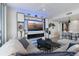 Cozy living room with custom built-ins, fireplace, and comfortable sectional sofa at 5120 Marina Way # 6603, Tampa, FL 33611