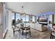 Bright living space with dining area featuring waterfront view and modern chandelier and decor at 5120 Marina Way # 6603, Tampa, FL 33611