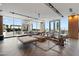Bright living room with floor-to-ceiling windows, offering panoramic views and contemporary furnishings at 5120 Marina Way # 6603, Tampa, FL 33611