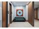 A sophisticated lobby featuring a cozy green couch and an eye-catching circular wall art above it at 5120 Marina Way # 6603, Tampa, FL 33611