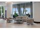 Inviting lobby area with comfortable seating, stylish decor, floor-to-ceiling windows, and natural light at 5120 Marina Way # 6603, Tampa, FL 33611