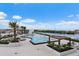 Expansive community pool and lounge area with lush landscaping and waterfront views at 5120 Marina Way # 6603, Tampa, FL 33611