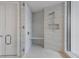 New walk-in shower featuring grey tile, white hexagon floor, shower bench, and dual shower heads at 5120 Marina Way # 6603, Tampa, FL 33611