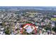 An aerial view of a home with a gray roof in a quiet neighborhood at 5566 104Th Way, Seminole, FL 33772