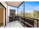 Balcony offering outdoor living space with a serene view of the surrounding greenery and clear sky at 5980 80Th N St # 410, St Petersburg, FL 33709