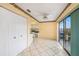 Sunny dining area adjacent to kitchen with sliding glass door to balcony at 5980 80Th N St # 410, St Petersburg, FL 33709