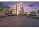 Apartment building exterior with ample parking spaces available to residents at 5980 80Th N St # 410, St Petersburg, FL 33709