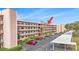 Multi-story condo building with balconies and ample parking at 5980 80Th N St # 410, St Petersburg, FL 33709