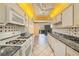 Bright kitchen with white appliances, marble countertops and breakfast bar at 5980 80Th N St # 410, St Petersburg, FL 33709