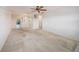 Bright living room with neutral walls, a ceiling fan, and carpet at 5980 80Th N St # 410, St Petersburg, FL 33709