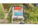 Aerial view of a community pool, complete with lounge chairs and a covered area for relaxation at 5980 80Th N St # 410, St Petersburg, FL 33709