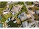 Aerial view of properties with pools, docks, and boats on the water, surrounded by lush landscaping at 6322 Cottonwood Ln, Apollo Beach, FL 33572