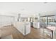 Open kitchen featuring stainless steel appliances, a stone accent wall, and views of the outdoor pool at 6322 Cottonwood Ln, Apollo Beach, FL 33572