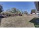 An empty back yard with a wooden fence on a sunny day at 6532 30Th N St, St Petersburg, FL 33702