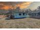 Backyard view of the house with a small deck and fenced yard at 6532 30Th N St, St Petersburg, FL 33702