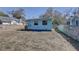 Backyard view of the house with a small deck and fenced yard at 6532 30Th N St, St Petersburg, FL 33702