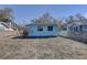 Backyard view of the house with a small deck and fenced yard at 6532 30Th N St, St Petersburg, FL 33702