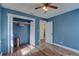 Bedroom with a closet, access to an additional room, and hardwood flooring at 6532 30Th N St, St Petersburg, FL 33702