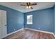 Bedroom featuring hardwood floors, a ceiling fan, and ample natural light at 6532 30Th N St, St Petersburg, FL 33702