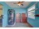 Laundry room with a stacked washer/dryer unit and extra storage space at 6532 30Th N St, St Petersburg, FL 33702