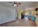 Bright and airy living area with open access to the kitchen, featuring wooden floors at 6532 30Th N St, St Petersburg, FL 33702