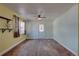 Inviting living room featuring hardwood floors, ceiling fan, and plenty of natural light at 6532 30Th N St, St Petersburg, FL 33702