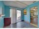 Open living room with a sliding glass door and access to dining area at 6532 30Th N St, St Petersburg, FL 33702