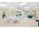 Large event space featuring tables with white linens and chairs, perfect for gatherings at 8150 Southern Pines Dr, Brooksville, FL 34601
