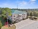 Exterior view of multi-story building featuring balconies, staircases, and parking at 8150 Southern Pines Dr, Brooksville, FL 34601