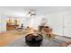 Bright living room and dining area open to the kitchen with a ceiling fan and hard surface flooring at 8150 Southern Pines Dr, Brooksville, FL 34601