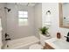 Bright bathroom with tiled shower and tub at 9987 85Th Way, Seminole, FL 33777